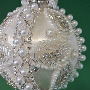 Pearl, rhinestone, and bugle bead leaves are the centerpiece for this beautiful Christmas or wedding ornament (3&quot; ball)
