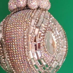 Rhinestone baguettes swirl around 4 large marquise jewels on a background of AB rhinestones on this exquisitely blingy ornament (3&quot; ball)