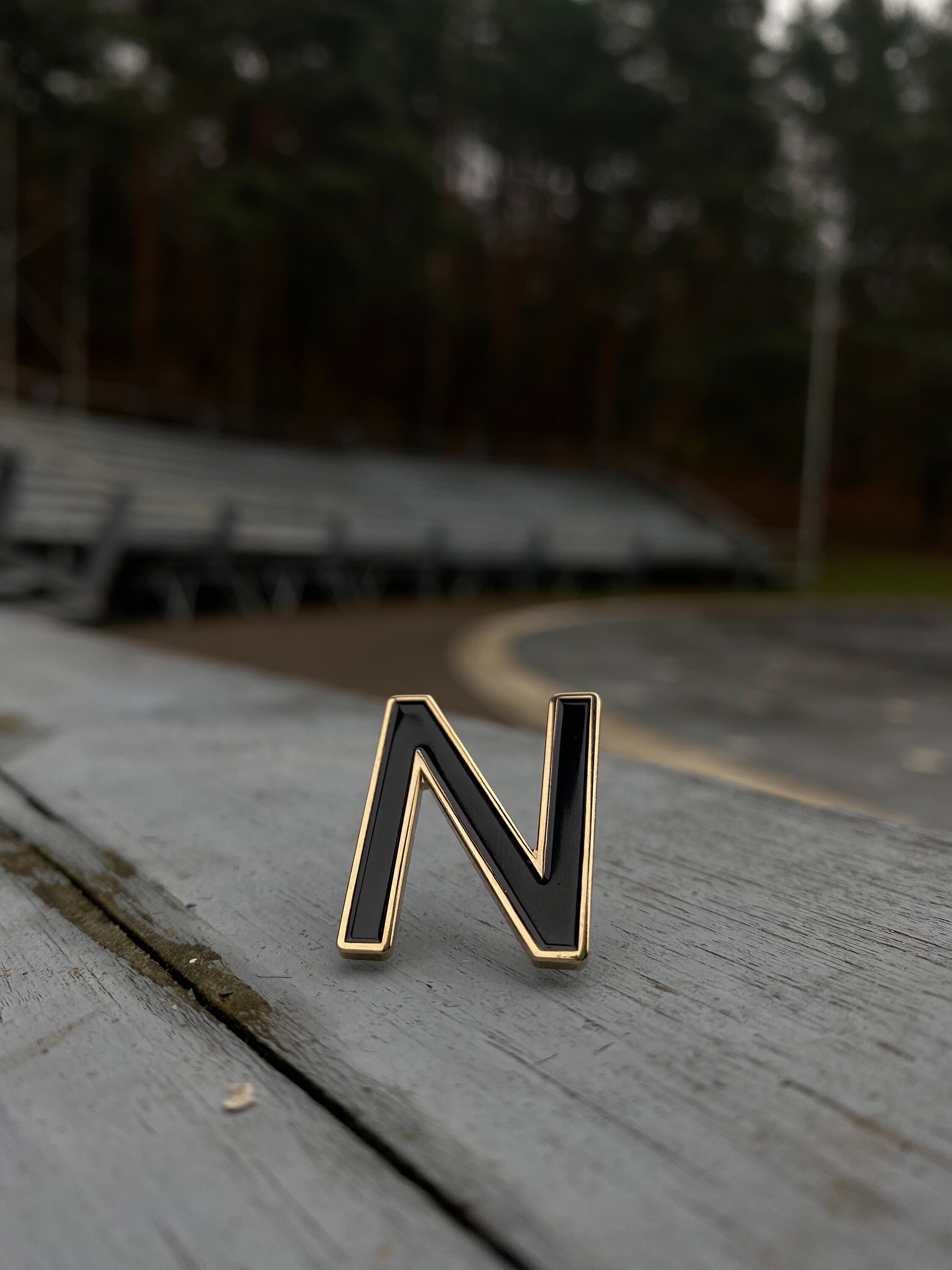 No Red Circle And Slash Symbol Over The Letter N Cloisonné Tie Lapel Pin  .75