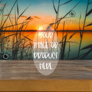 May include: A wooden table with a blurred background of a sunset over a lake with tall reeds. The text "YOUR IMAGE OR PRODUCT HERE" is in a white circle on the table.