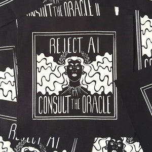 May include: A collection of square black fabric patches featuring a white screen-printed graphic of a person with wavy hair wearing a laurel wreath. The text REJECT AI and CONSULT THE ORACLE is printed in a bold, stylized font within a square border.
