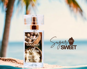 May include: A clear glass perfume bottle with a gold-colored top and a clear cap. The label reads "Coconut Shea Organic Perfume" with images of coconuts and shea butter. The bottle contains 30ml (1 fl. oz). The brand name "Sugar me Sweet" is also visible.