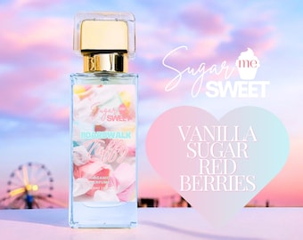 May include: A rectangular perfume bottle with a gold cap and a clear glass body. The label reads "Sugar Me Sweet Boardwalk Taffy" with a colorful candy design. The background features a heart-shaped graphic with "Vanilla Sugar Red Berries" text.