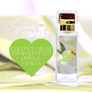 May include: A clear perfume bottle with a gold cap and the words "Sugar Me Sweet" and "Coco Lime Colada" printed on the label. The label also includes a graphic of a lime and pineapple. The bottle contains 1 fl oz of organic perfume.