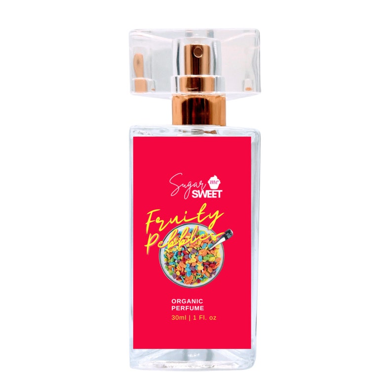 May include: Clear glass perfume bottle with a gold-colored atomizer and a clear plastic cap. The label is red with the words "Sugar Me Sweet" and "Fruity Pebbles" in a script font. The label also says "Organic Perfume" and "30ml | 1 Fl. oz."