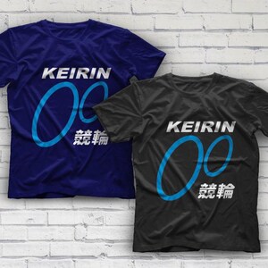 May include: Two t-shirts with a blue and white design. The design features the word "KEIRIN" and two overlapping circles. The text "競輪" is also included on the shirts.