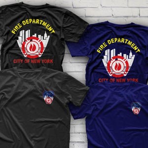May include: Three t-shirts with a graphic design of the New York City Fire Department logo. The logo features a red circle with a fire hydrant and flames inside. The text "Fire Department City of New York" is written in yellow around the circle.