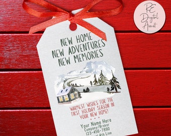 May include: A white gift tag with a watercolor illustration of a snowy house and trees. The text on the tag reads "New Home New Adventures New Memories" and "Warmest wishes for the first holiday season in your new home!" with space for a name, company, phone number, and optional fourth line.