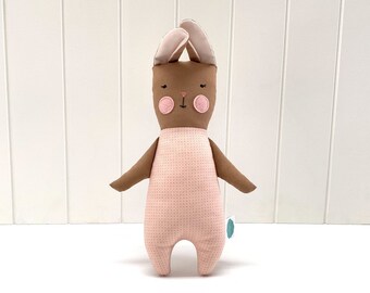 Small cotton rabbit doll, handmade children's toy.
