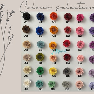 Puede incluir: Tabla de selecci&oacute;n de colores con 36 muestras de flores de papel. Las flores est&aacute;n dispuestas en seis filas de seis, etiquetadas de A1 a F6. Cada fila presenta una paleta de colores diferente, incluyendo negro, azul, naranja, rojo, rosa y morado.