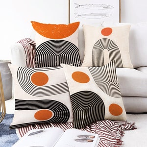 Abstract Ivory Cushion Cover Designs with Orange & Black Geometric Patterns | Double Sided Printing on the Suede with Different Sizes