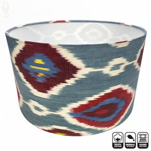 May include: A blue and red patterned lampshade made of 100% cotton, handwoven and herbally dyed.