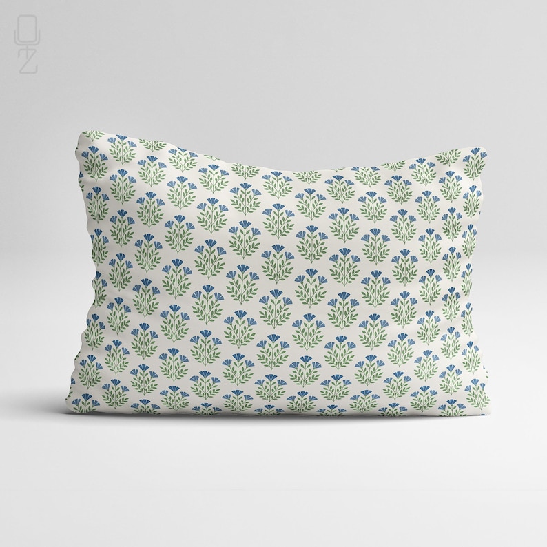 Professional studio shot of a blue wildflower chenille pillow cover on a clean white background, showcasing the repeating block print pattern.