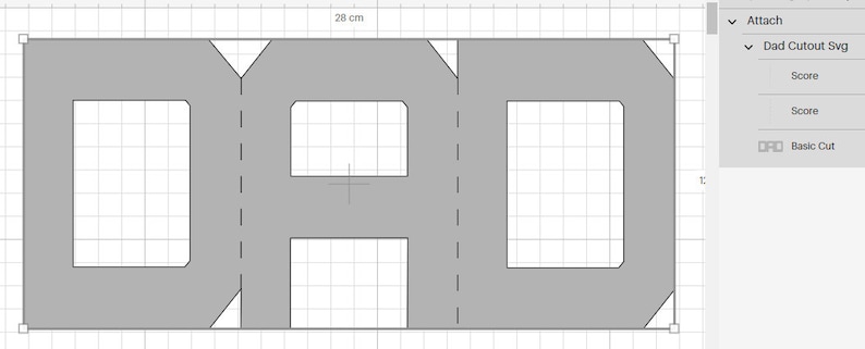 May include: A gray paper cutout of the word "DAD" with score lines and basic cut lines indicated. The design is 28 cm wide.