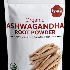 May include: A white resealable pouch with a red and white label. The label reads "Organic Ashwagandha Root Powder" and "Vegan. Gluten-Free. Superfood. Non-GMO". The pouch also features a USDA Organic seal and a red logo with the text "iyasa HOLISTICS". The pouch contains a 1lb (454g) bag of organic ashwagandha root powder.