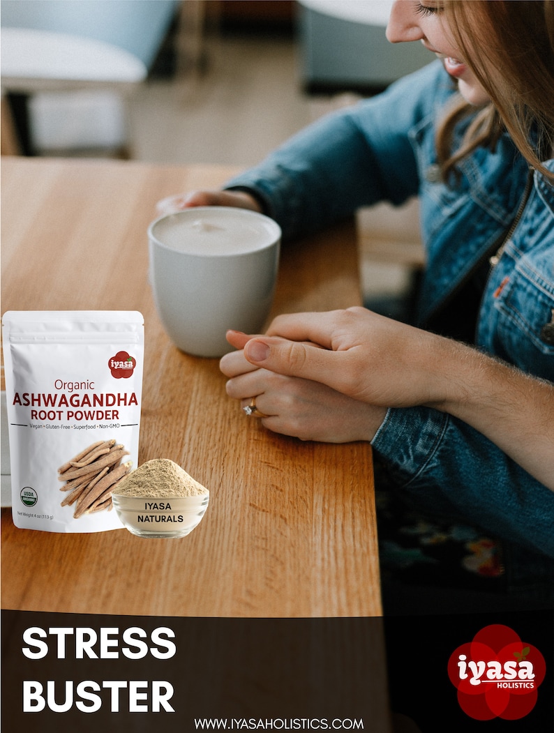 May include: A white mug with a brown liquid inside, a bag of organic Ashwagandha root powder, and the text "Stress Buster" on a wooden table. The bag is labeled "iyasa Naturals" and features a picture of a root. The text "www.iyasaholisitcs.com" is also visible.
