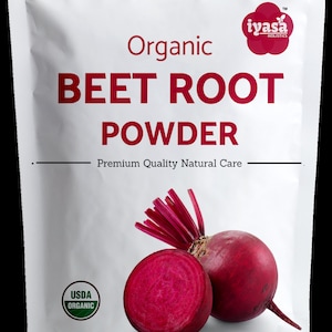 May include: A white bag with a red and white label that says "Organic Beet Root Powder" and "Premium Quality Natural Care". The bag also has a USDA Organic seal and a picture of a beet.