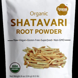 May include: A white resealable pouch with a label that reads "Organic Shatavari Root Powder". The label also includes the text "Raw Vegan Gluten-Free Superfood Non-GMO" and a USDA Organic seal. The pouch contains a pile of dried Shatavari root powder. The net weight is 8 oz (226 g) (0.5 lb).