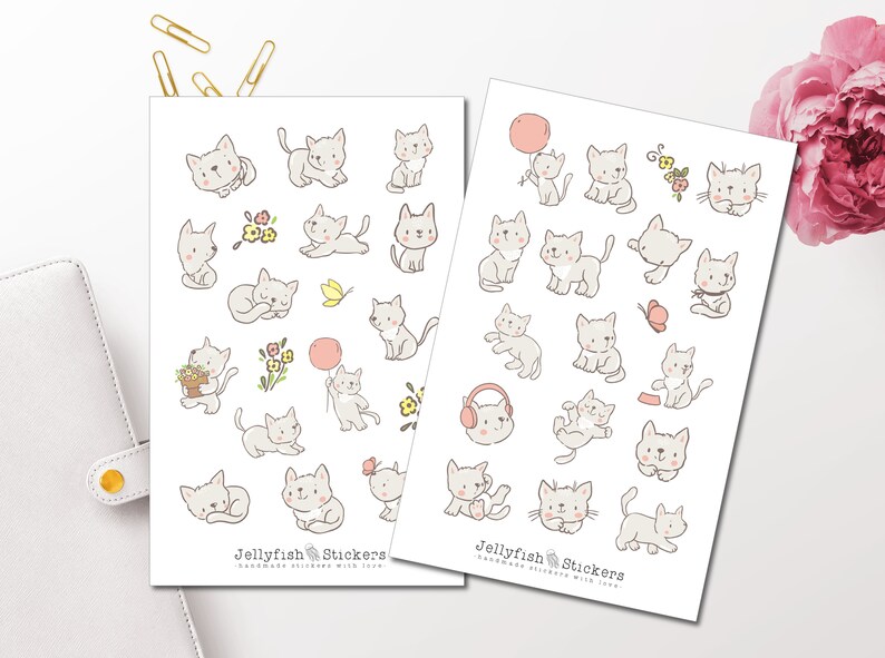 May include: Two sheets of stickers featuring hand-drawn illustrations of adorable gray kittens in various poses. Some kittens hold balloons or flowers. The text "Jellyfish Stickers" is at the bottom of each sheet.