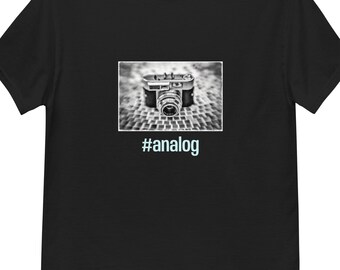 May include: Black t-shirt with a black and white image of a vintage camera and the text "#analog" in light blue.