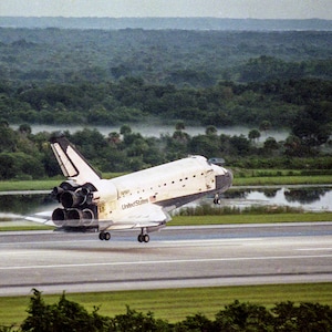 Down to Earth - Space Shuttle Columbia lands inFlorida - Poster Print