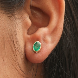 Emerald oval cut bezel set mini studs earrings gold | Natural oval cut emerald stud earring gold | Emerald mini oval studs earrings gold