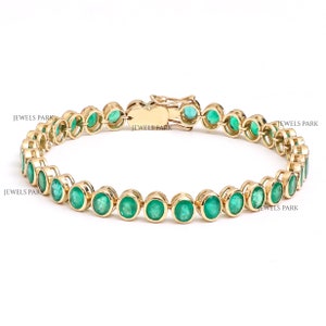 Oval emerald bezel set tennis bracelet in 14K gold | Emerald gold tennis bracelet with oval stones | Natural emerald tennis bracelet