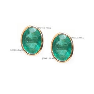 Emerald oval cut bezel set mini studs earrings gold | Natural oval cut emerald stud earring gold | Emerald mini oval studs earrings gold