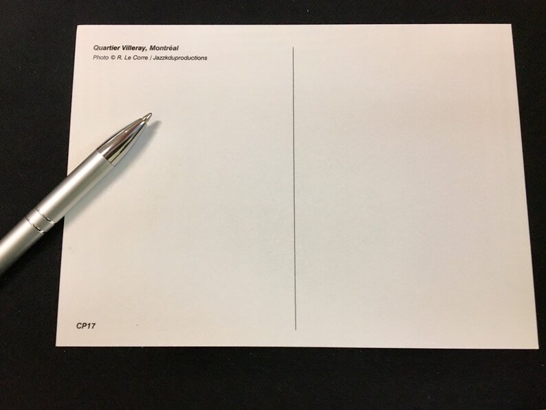 May include: A white postcard with the text "Quartier Villeray, Montreal" and "Photo &copy; R. Le Corre / Jazzikproductions" printed on the front. The back of the postcard is blank with a vertical line down the center. The text "CP17" is printed in the bottom left corner.