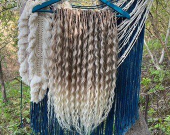 Platinum blond wavy hair extensions, crochet double ended extensions, curly thick dreadlocks, push up braid in dreads, loose wave dreadlocks