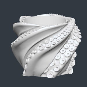 May include: A white, stylized octopus-tentacle-shaped container. The design features swirling, textured forms with numerous circular suckers along the edges, creating a unique and artistic appearance. The container is set against a dark gray background.