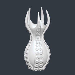 May include: A white, abstract vase with a unique design. The vase features a series of tentacle-like protrusions at the top and a textured surface with circular patterns. The overall shape is reminiscent of an octopus.