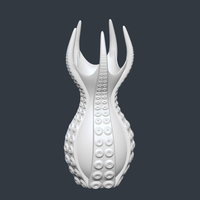 May include: A white, abstract vase with a unique design. The vase features a series of tentacle-like protrusions at the top and a textured surface with circular patterns. The overall shape is reminiscent of an octopus.