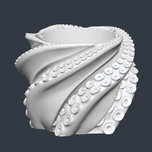 May include: A white, 3D-rendered octopus-themed vase. The vase is sculpted with swirling tentacles, each detailed with suction cups. The design is smooth and modern, with a dark gray background.