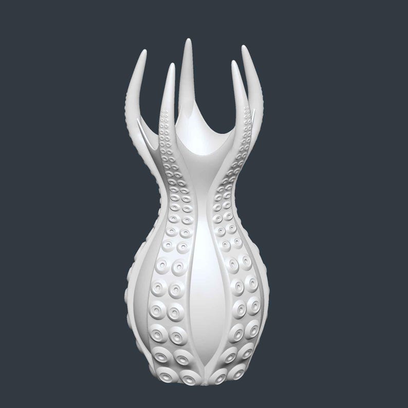 May include: A white, stylized vase with an octopus-inspired design. The vase features multiple tentacle-like protrusions at the top and a body adorned with circular suction cup details. The overall shape is elegant and modern.