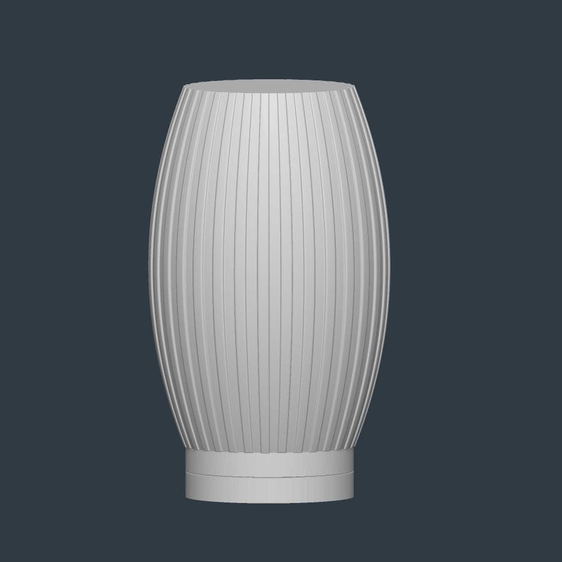 May include: A white, vertically ribbed vase with an oval shape. The vase has a cylindrical base and a smooth, flat top. The ribbed design creates a textured surface, adding visual interest to the piece. The vase is a neutral color.