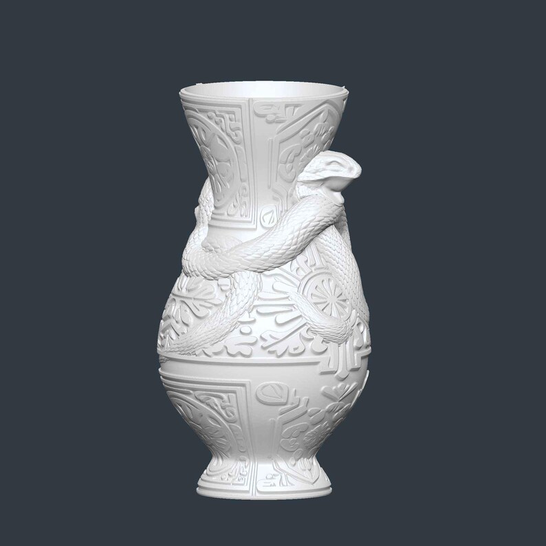 May include: White ceramic vase with a detailed relief design and a snake wrapped around the body. The vase has a wide base, a narrow neck, and a flared rim. The snake's head is at the top, and the body coils around the vase.