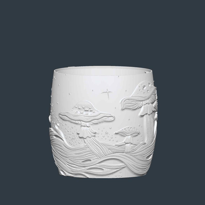 May include: White cylindrical glass with an embossed design of mushrooms and flowing lines. The design includes three mushrooms of varying sizes, with a star and small dots scattered around the scene. The glass has a smooth, unadorned rim.