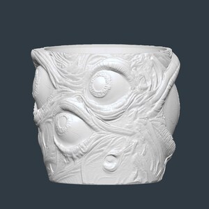 May include: A white, cylindrical plant pot with a textured surface. The pot features a detailed relief of multiple eyes and organic, vein-like patterns, creating a unique, eerie aesthetic.