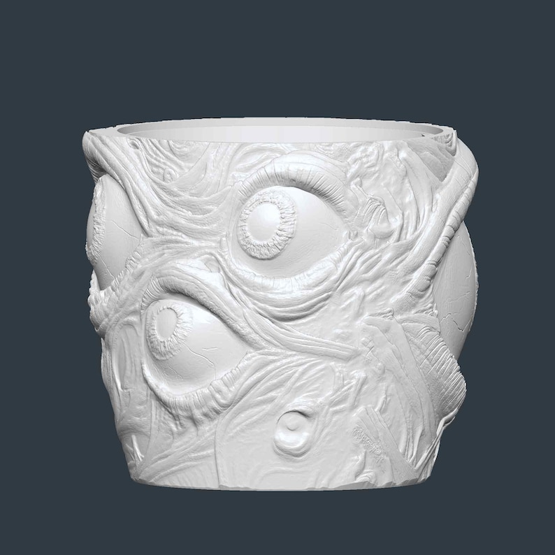May include: A white, cylindrical plant pot with a textured surface. The pot features a detailed relief of multiple eyes and organic, vein-like patterns, creating a unique, eerie aesthetic.