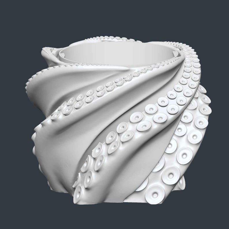May include: A white, stylized octopus-themed container. The design features swirling tentacles forming the body, with suction cups visible. The top has a circular opening. The overall shape is reminiscent of a vase or bowl.