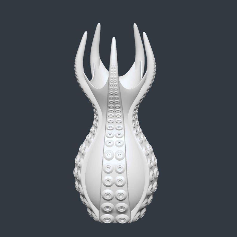 May include: A white, abstract vase with a unique design. The vase features a series of tentacle-like protrusions and circular patterns, creating a textured surface. The design is symmetrical and stands out against a dark background.