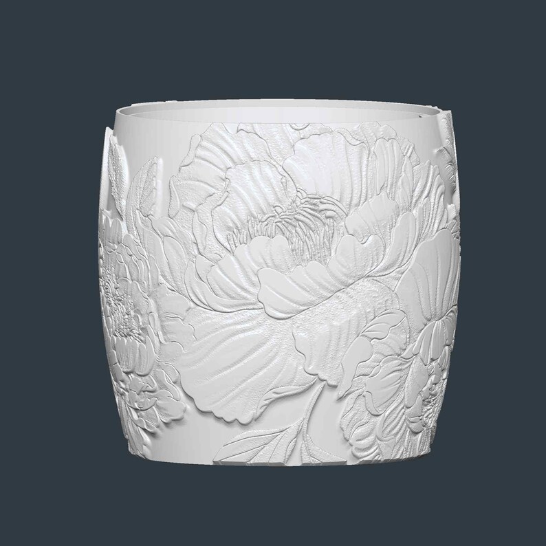 Peut inclure: Un pot de fleurs cylindrique blanc avec un motif floral en relief d&eacute;taill&eacute;. Les fleurs et les feuilles en relief enveloppent l'ext&eacute;rieur du pot, cr&eacute;ant une surface textur&eacute;e. Le pot convient &agrave; une utilisation int&eacute;rieure ou ext&eacute;rieure.