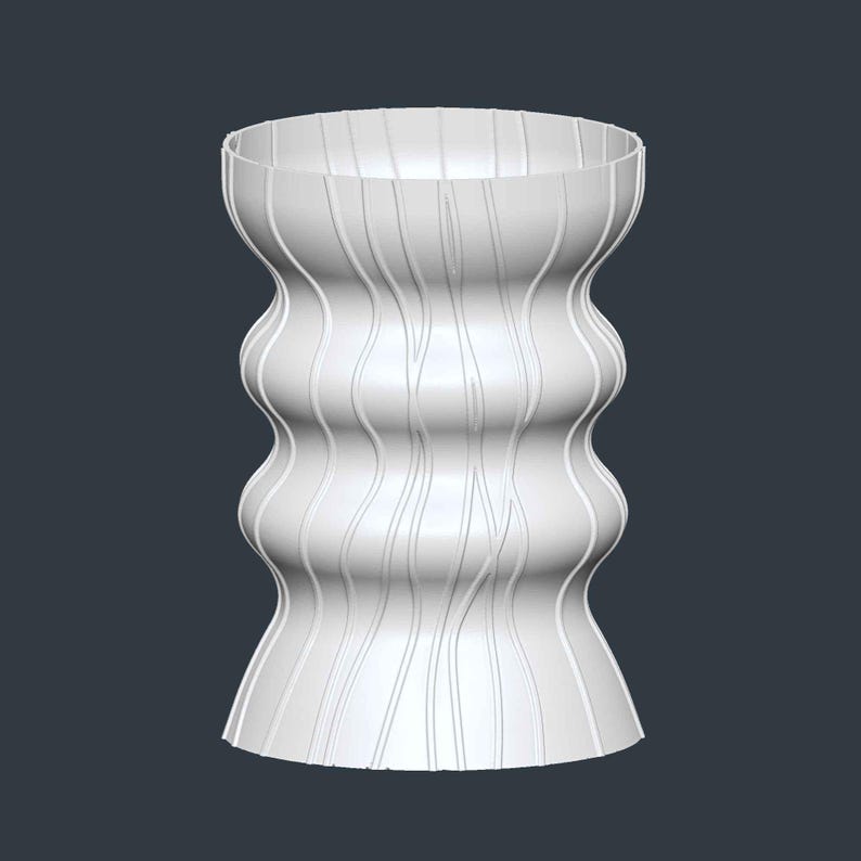 May include: A white, decorative vase with a unique, undulating shape. The vase has a wide, open top and a flared base. Vertical, thin lines run down the sides, adding texture. The design is modern and minimalist, suitable for home decor.