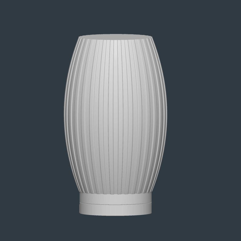 May include: A white, vertically ribbed vase with an oval shape. The vase has a cylindrical base and a smooth, flat top. The ribbed design creates a textured surface. The background is a solid, dark blue-gray.