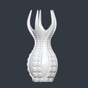 May include: A white, stylized vase with an octopus-inspired design. The vase features multiple tentacle-like arms extending upwards and a body adorned with circular suckers. The overall shape is elegant and modern, suitable for home decor.