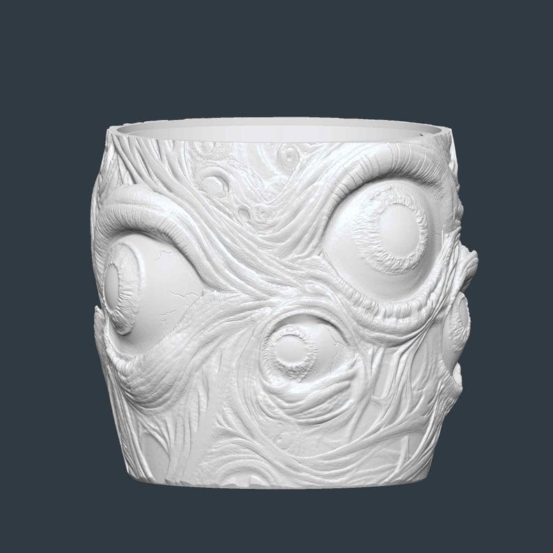 May include: A white, cylindrical planter with a detailed, textured surface. The design features multiple large, open eyes and intricate, vein-like patterns, creating a unique and artistic aesthetic. The planter is suitable for indoor or outdoor use.
