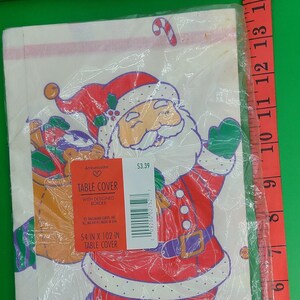 Vintage Hallmark Christmas tablecloth, paper-NOS. Santa and elves.