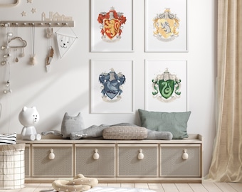 May include: Four framed prints of the Hogwarts house crests, Gryffindor, Hufflepuff, Ravenclaw, and Slytherin, are displayed on a white wall above a wooden bench with storage compartments. The bench is decorated with a plush toy cat and a white plush toy bear.