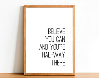 May include: A framed print with the motivational quote "Believe you can and you're halfway there" in black text on a white background.